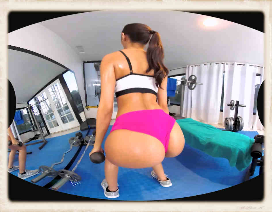 Gianna Dior does some dumbbell exercises in a gym setting